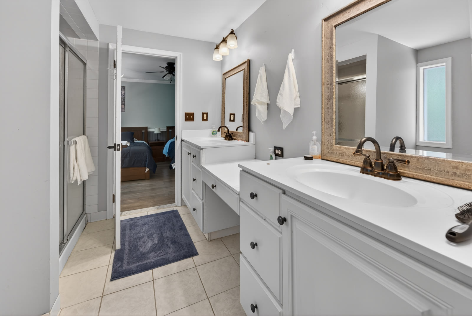 Bathroom with a double vanity and walk-in shower