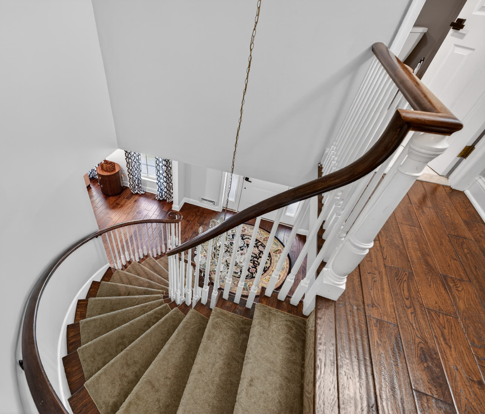 The curved staircase at the heart of the home