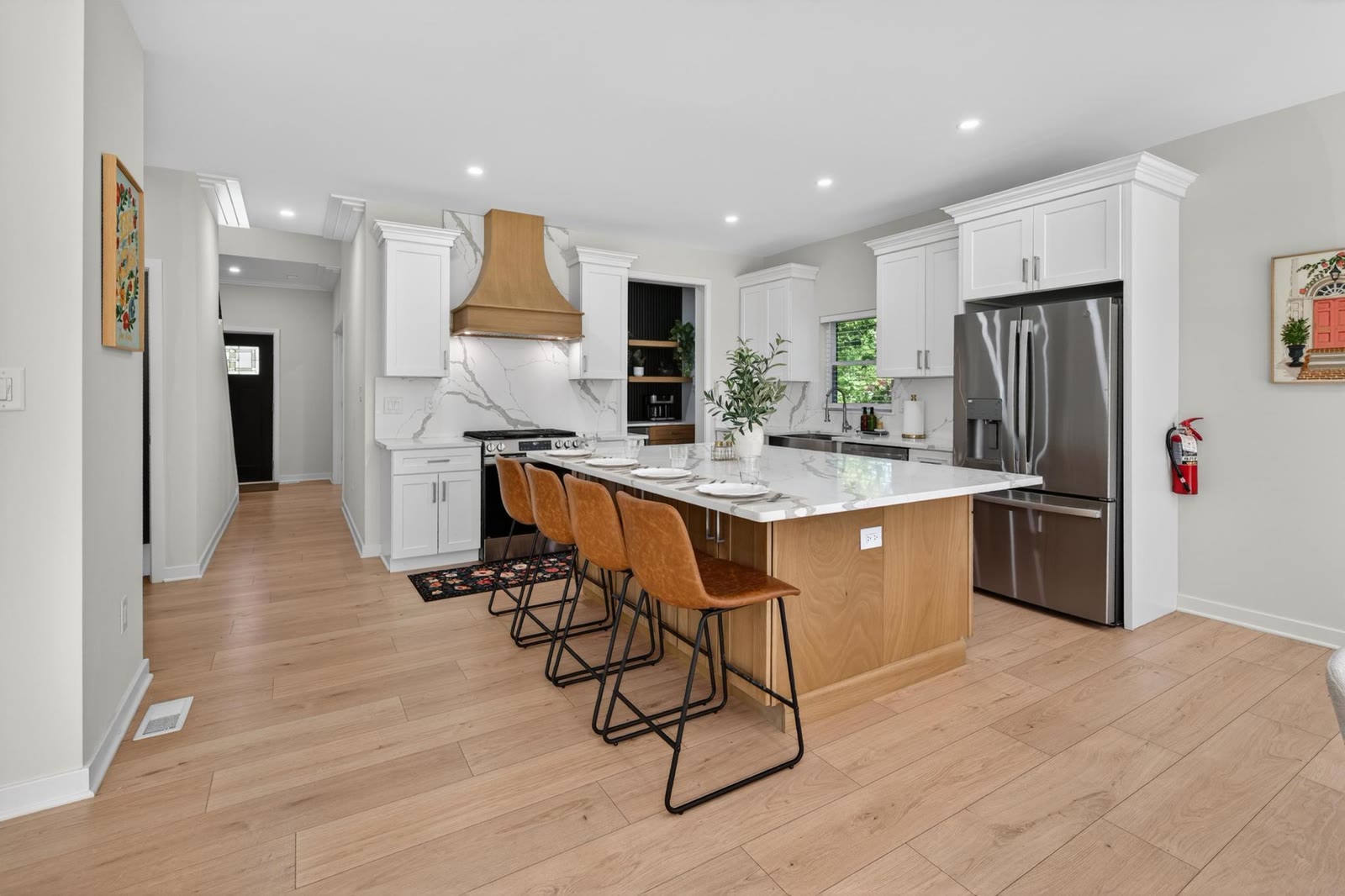 Open kitchen with a big island and seating at Scottie's Sanctuary